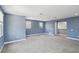 Spacious bonus room with plush carpeting, recessed lighting, and lots of natural light at 1902 Marshberry Ct, New Port Richey, FL 34655