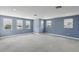Spacious bonus room with plush carpeting, recessed lighting, and lots of natural light at 1902 Marshberry Ct, New Port Richey, FL 34655