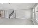 Spacious living area with large windows, neutral paint, and ceramic tile, perfect for entertaining at 1902 Marshberry Ct, New Port Richey, FL 34655