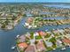 Aerial view of the home featuring lush landscaping and nearby waterfront access at 1917 Iowa Ne Ave, St Petersburg, FL 33703
