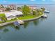 Waterfront home with private dock, boat lift, seawall, and lush landscaping overlooking the beautiful bay at 1917 Iowa Ne Ave, St Petersburg, FL 33703