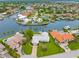 The property features an aerial view of the harbor with mature trees and a landscaped lawn at 1917 Iowa Ne Ave, St Petersburg, FL 33703
