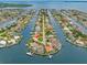 Breathtaking aerial shot of waterfront homes nestled in a serene canal community with beautiful landscaping at 1917 Iowa Ne Ave, St Petersburg, FL 33703