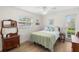 Bright bedroom features wood floors, and a large window with lots of natural light at 1917 Iowa Ne Ave, St Petersburg, FL 33703