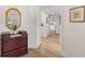 Bright hallway features wood floors, fresh paint, and classic decor, creating a welcoming atmosphere at 1917 Iowa Ne Ave, St Petersburg, FL 33703