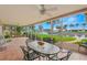 Screened lanai with dining table and chairs overlooking a waterfront canal at 1917 Iowa Ne Ave, St Petersburg, FL 33703