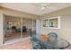 Outdoor dining space on a covered lanai with views into a living room and the backyard at 1917 Iowa Ne Ave, St Petersburg, FL 33703