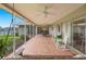 Spacious lanai with tile floors, rocking chairs and a swing, perfect for outdoor relaxation at 1917 Iowa Ne Ave, St Petersburg, FL 33703