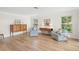 Comfortable living room with plenty of seating and natural light from large windows at 1917 Iowa Ne Ave, St Petersburg, FL 33703