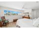 A serene main bedroom with tranquil views of the water and ample natural light at 1917 Iowa Ne Ave, St Petersburg, FL 33703