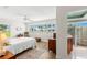 A sunlit main bedroom features a view, creating a serene retreat at 1917 Iowa Ne Ave, St Petersburg, FL 33703