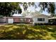 Charming single-story home with a brick facade, manicured lawn, and an attached one-car garage at 2010 6Th Sw Ave, Largo, FL 33770