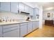 Kitchen with blue cabinets, white countertops, and hardwood flooring offering a clean, classic style at 2010 6Th Sw Ave, Largo, FL 33770