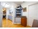 Bright kitchen area with hardwood floors, blue cabinets, and open access to other rooms at 2010 6Th Sw Ave, Largo, FL 33770