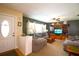 Comfortable living room with plush sofas, a white brick accent, and a view of the front entry at 2010 6Th Sw Ave, Largo, FL 33770