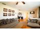 Cozy living room with hardwood floors, comfortable seating, and a view into the hallway/office at 2010 6Th Sw Ave, Largo, FL 33770