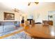 Bright living room featuring hardwood floors, a ceiling fan, and a sectional sofa at 2010 6Th Sw Ave, Largo, FL 33770