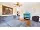 Comfortable living room featuring a large sofa, hardwood floors, and a mounted television at 2010 6Th Sw Ave, Largo, FL 33770