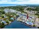 Enjoy this aerial view of waterfront community with docks, boats, and gulf access at 2011 Ketch Cir, Palm Harbor, FL 34683