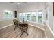 Bright dining area with many windows at 2011 Ketch Cir, Palm Harbor, FL 34683