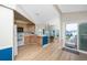 Bright kitchen with island and modern appliances with an adjacent dining nook at 2011 Ketch Cir, Palm Harbor, FL 34683