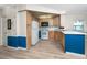 Bright kitchen featuring modern appliances, light wood cabinets, and updated flooring at 2011 Ketch Cir, Palm Harbor, FL 34683