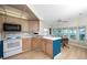 Bright kitchen featuring updated appliances, modern flooring, and casual dining at 2011 Ketch Cir, Palm Harbor, FL 34683