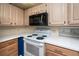 Bright kitchen featuring modern appliances and white countertops at 2011 Ketch Cir, Palm Harbor, FL 34683