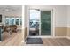 Open-concept living area with modern flooring, sliding glass doors to the outdoor porch at 2011 Ketch Cir, Palm Harbor, FL 34683