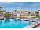 Enjoy this community pool and neighboring home with fenced in yard at 2011 Ketch Cir, Palm Harbor, FL 34683