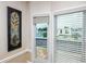 Window view featuring a canal, swimming pool, and adjacent home at 2011 Ketch Cir, Palm Harbor, FL 34683