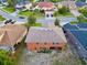 Spacious home featuring a screened-in patio and a well-maintained lawn in a desirable neighborhood at 2038 Oswego Dr, Holiday, FL 34691
