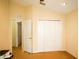 Bright bedroom with large closet space and adjacent doorway, plus neutral color scheme at 2038 Oswego Dr, Holiday, FL 34691