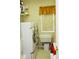 Functional laundry room with washer, dryer, shelving and natural light at 2038 Oswego Dr, Holiday, FL 34691
