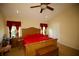 Comfortable main bedroom with vaulted ceiling, ceiling fan, and ample natural light at 2038 Oswego Dr, Holiday, FL 34691