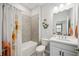 Charming bathroom featuring a shower and tub combo with bright, neutral decor at 21008 Fetterbush Pl, Venice, FL 34293