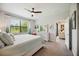 Bedroom with a ceiling fan, dresser, and decor at 21008 Fetterbush Pl, Venice, FL 34293