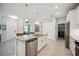 Spacious kitchen with a large island, stainless steel appliances, and ample cabinet space at 21008 Fetterbush Pl, Venice, FL 34293
