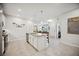 Bright kitchen with a granite island, stainless steel appliances, and an open floor plan at 21008 Fetterbush Pl, Venice, FL 34293
