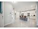 Bright kitchen with white cabinetry, stainless steel appliances, and an island with bar seating at 21008 Fetterbush Pl, Venice, FL 34293