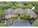 An aerial view showcases the building and its surroundings in a beautifully landscaped community at 2171 Portofino Pl # 27-2725, Palm Harbor, FL 34683