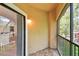 Screened balcony with views of community and trees at 2171 Portofino Pl # 27-2725, Palm Harbor, FL 34683