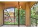 Screened balcony showcasing views of the surrounding foliage at 2171 Portofino Pl # 27-2725, Palm Harbor, FL 34683