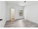Bedroom featuring wood-look floors, a ceiling fan, and a window with natural light at 2171 Portofino Pl # 27-2725, Palm Harbor, FL 34683