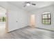 Bedroom showcasing wood-look flooring and a ceiling fan at 2171 Portofino Pl # 27-2725, Palm Harbor, FL 34683