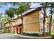Inviting exterior showcasing well-maintained landscaping and bright accents at 2171 Portofino Pl # 27-2725, Palm Harbor, FL 34683