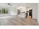 Spacious open-concept living space with modern flooring and white walls at 2171 Portofino Pl # 27-2725, Palm Harbor, FL 34683