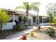 Spacious backyard featuring mature landscaping, brick pavers, and space for outdoor enjoyment at 2211 Harrison Dr, Holiday, FL 34691