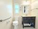 Updated bathroom featuring a new vanity and tiled floors at 2211 Harrison Dr, Holiday, FL 34691