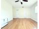 Large open floor plan with clean, neutral tones, and two white doors for an airy feel at 2211 Harrison Dr, Holiday, FL 34691
